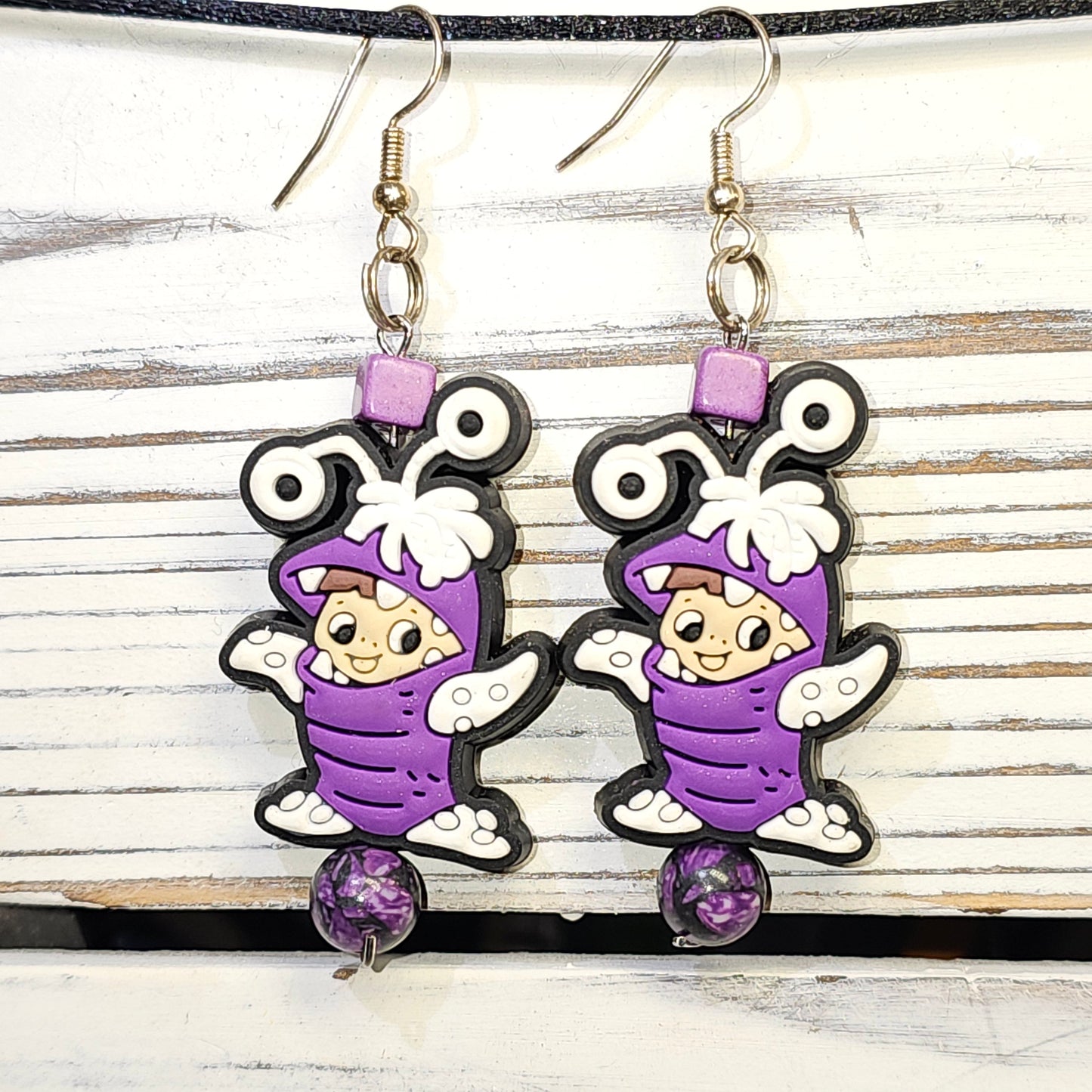 Purple guy earrings #35