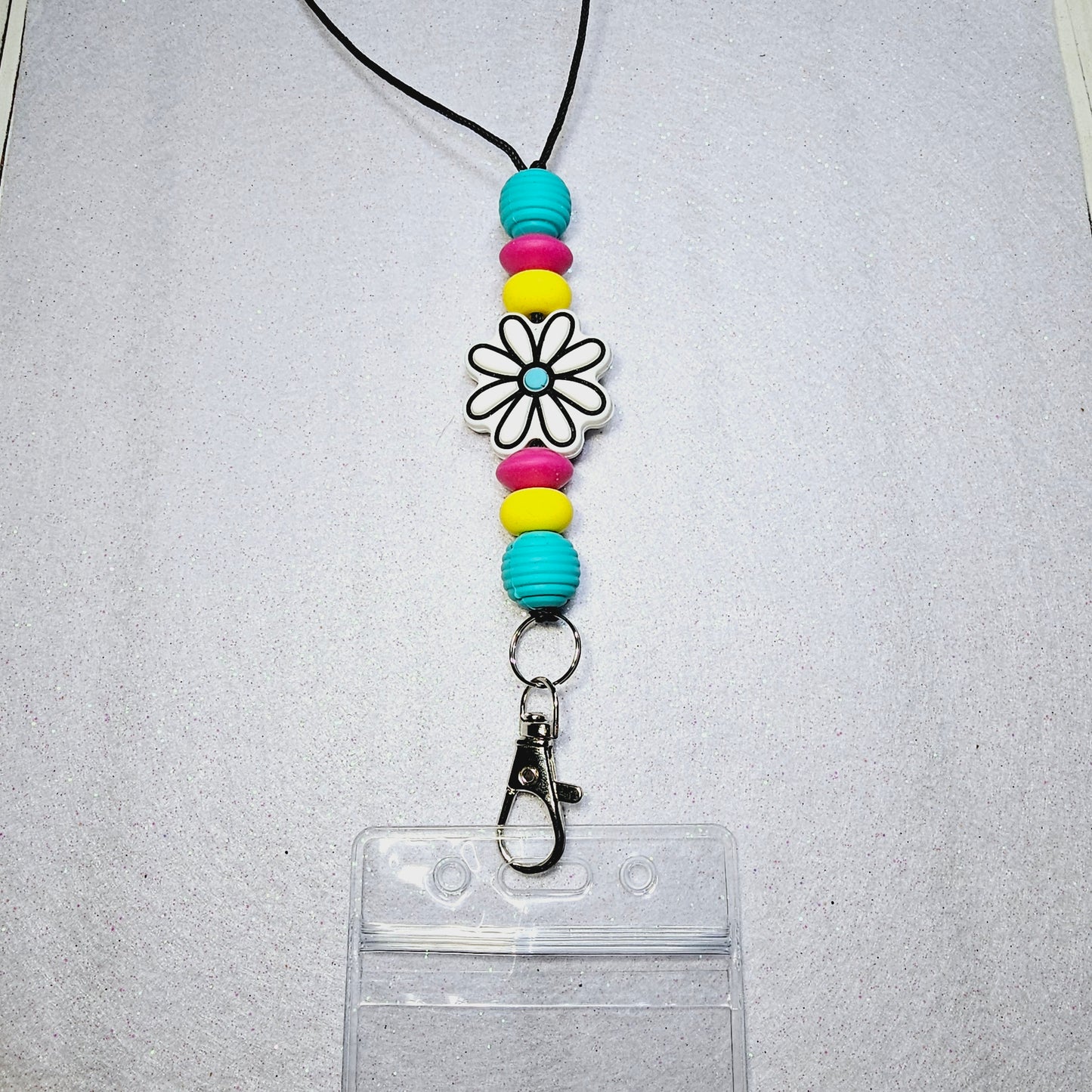 White/teal flower lanyard