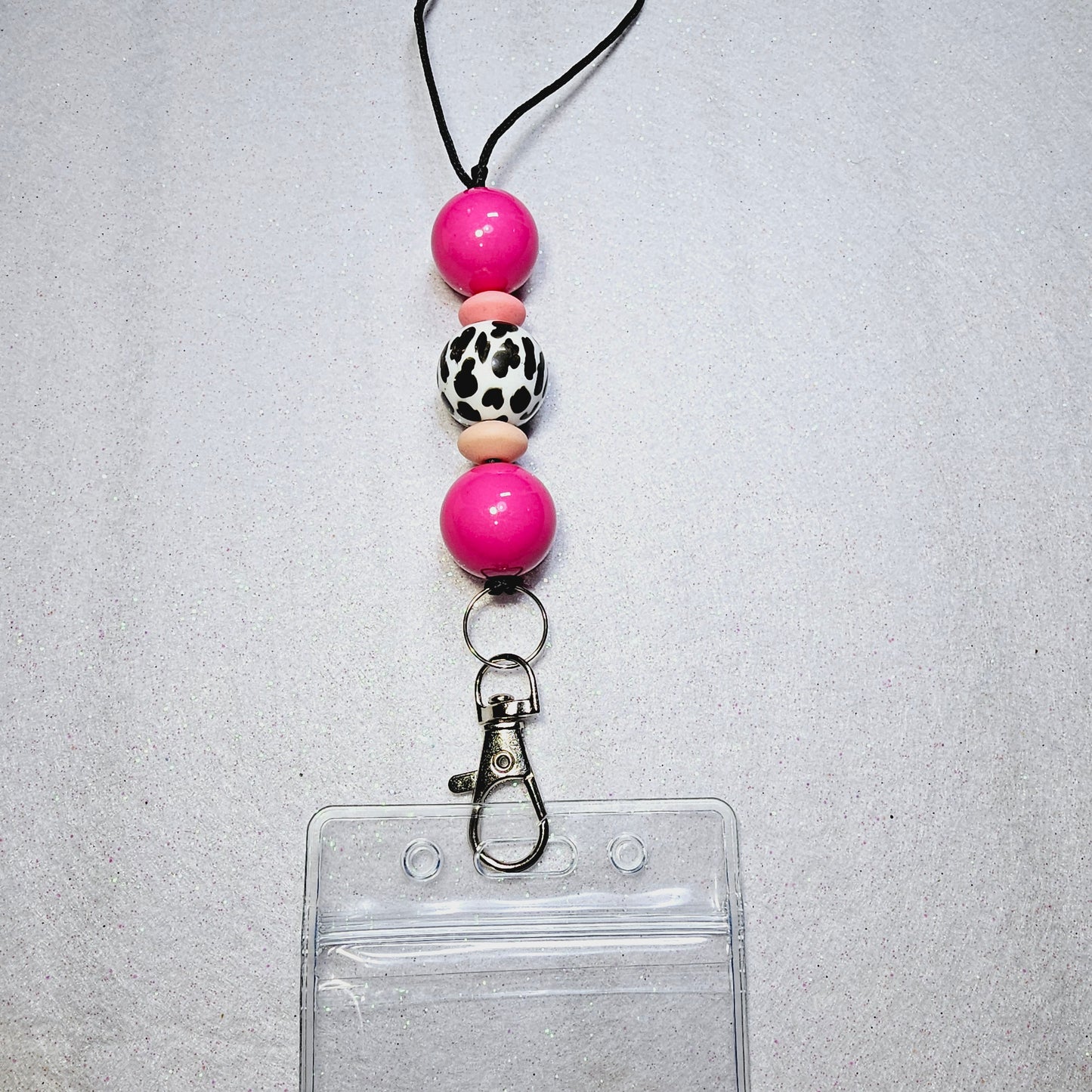 Pink and cow print lanyard