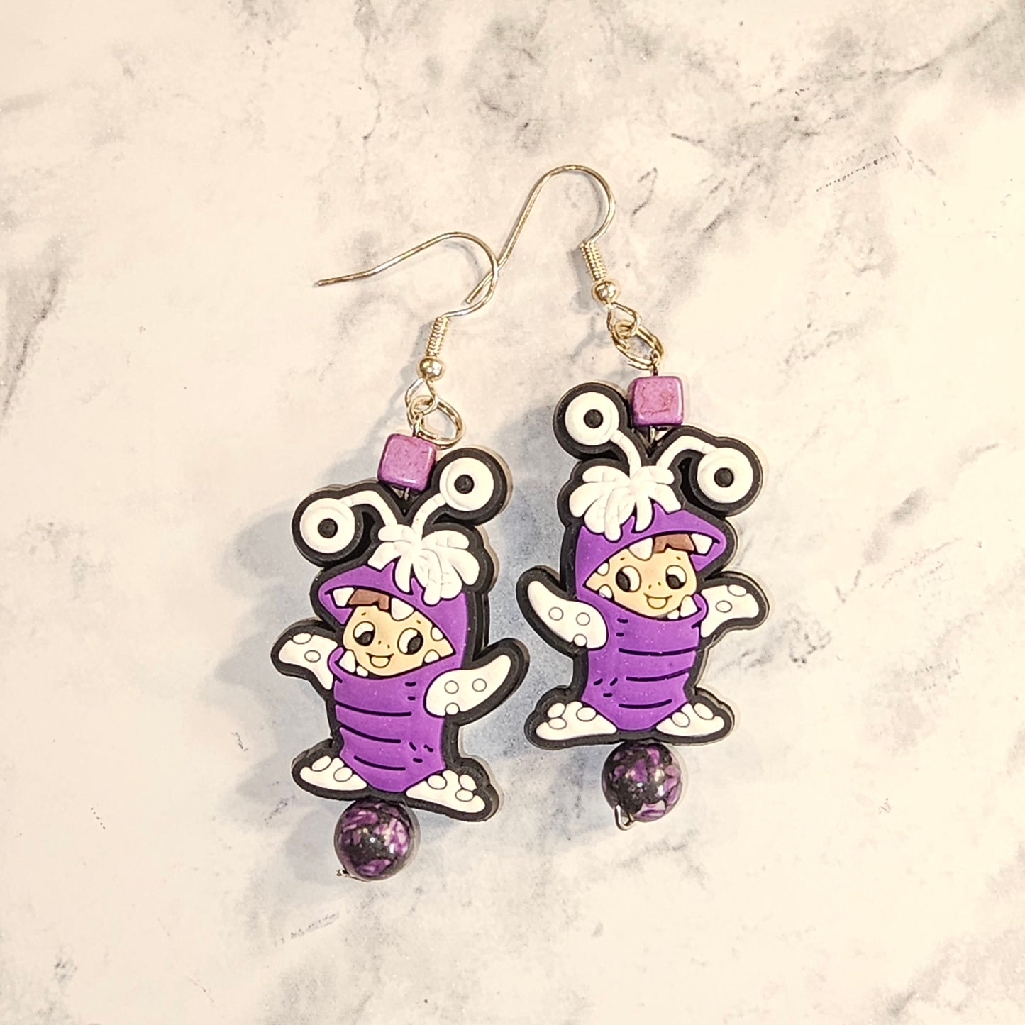 Purple guy earrings