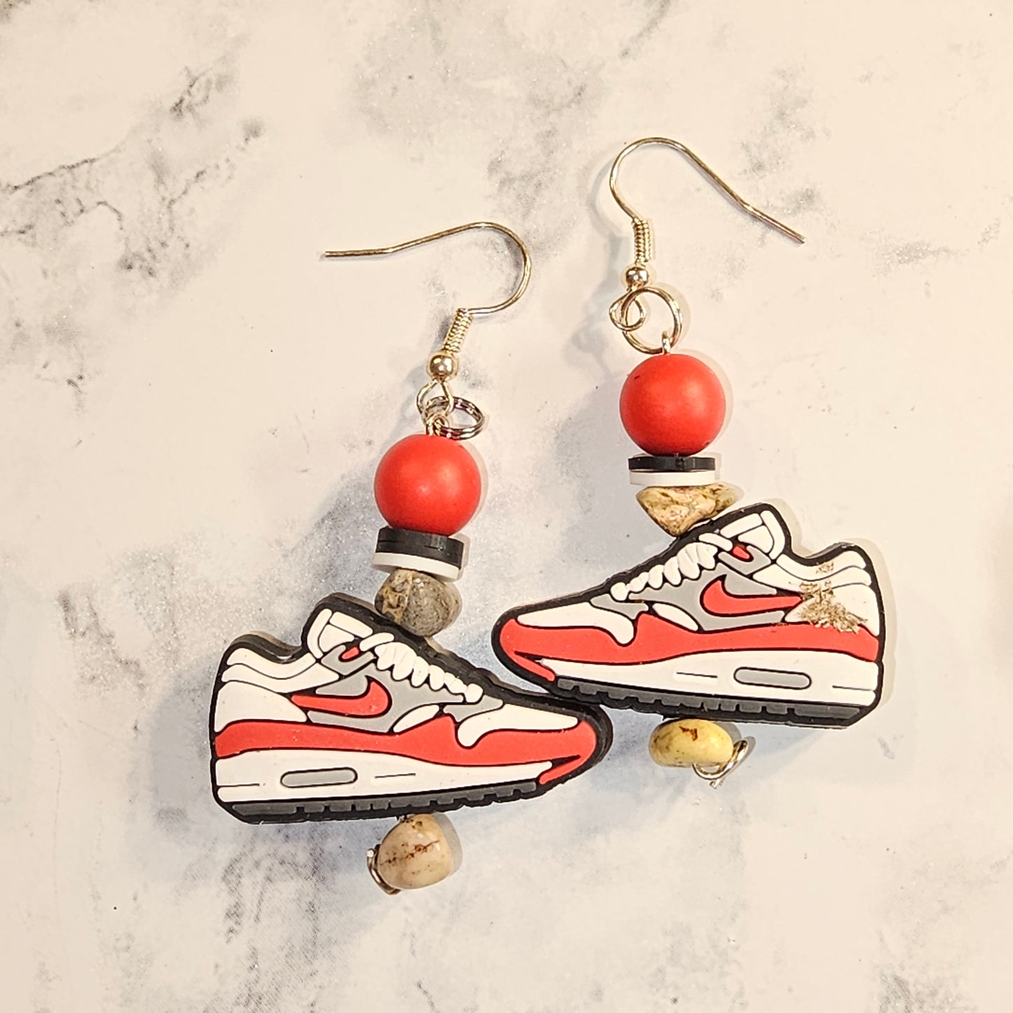 Red Nike earrings